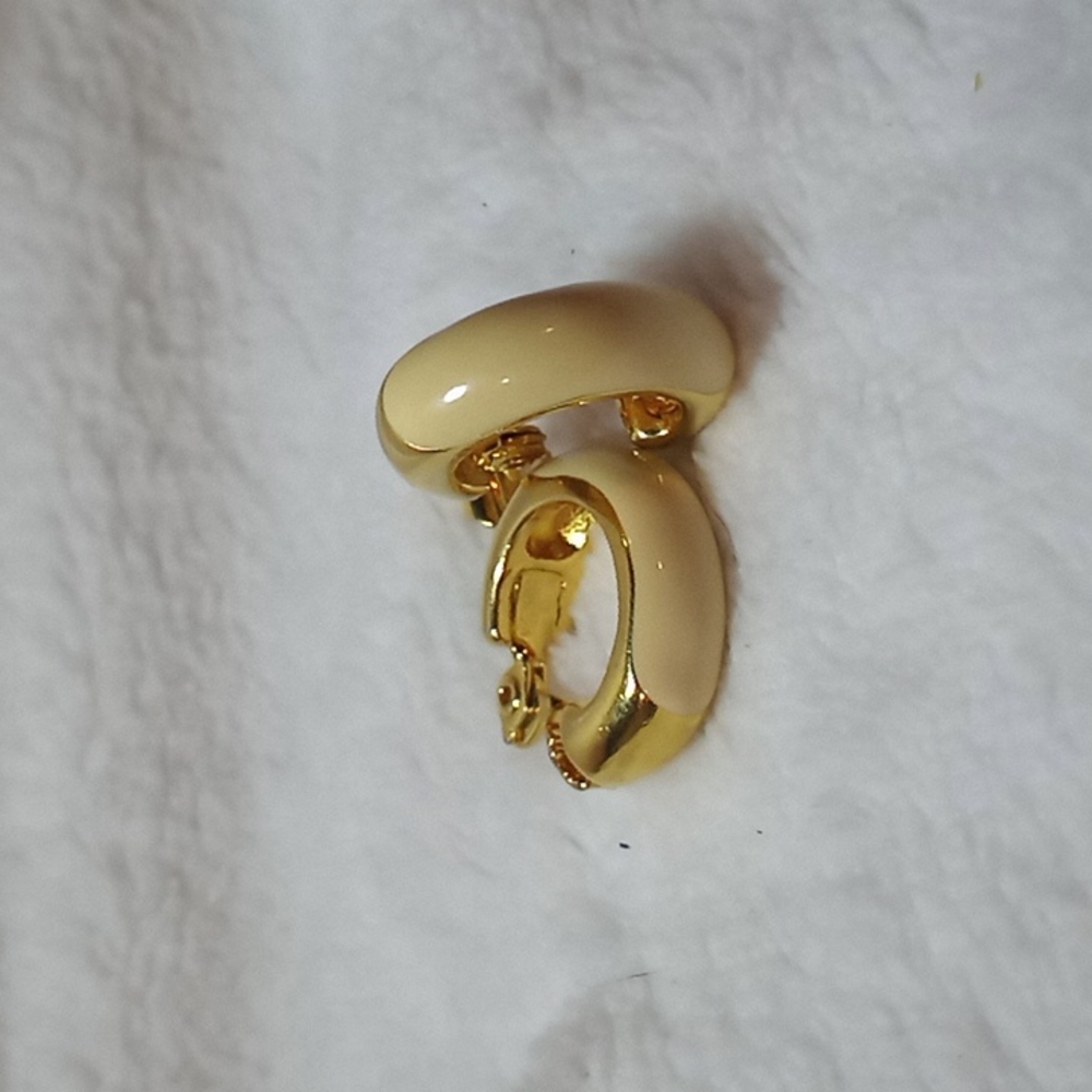 Vintage Monet clip on earrings. Cream enamel, gold toned